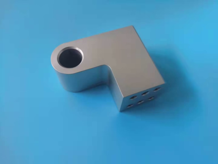 cnc machin contact service team reviewing a machined part