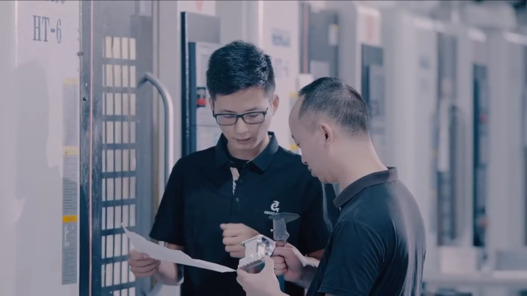 cnc machine servicing experts checking a machining center