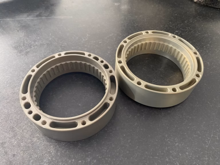 cnc micro machining mistakes on a micro machined part held under inspection